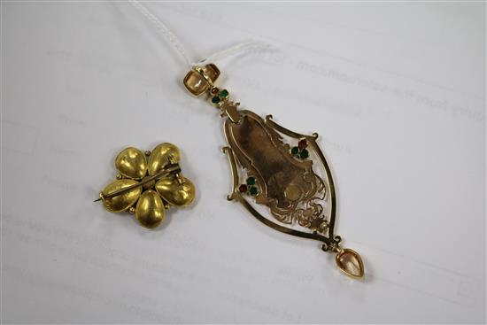 A yellow metal gem set and enamel pendant, a garnet set brooch and a gem set stick pin.